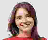 Smiling woman with reddish-brown hair wearing a red top.