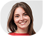 Smiling woman with brown hair wearing a red top.