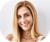 Smiling young woman with long blonde hair.